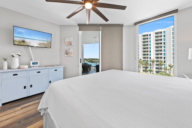 4207 Indian Bayou Trl Unit 2513, Destin, FL 32541 - bedroom with access to exterior, wood finished floors, and a ceiling fan