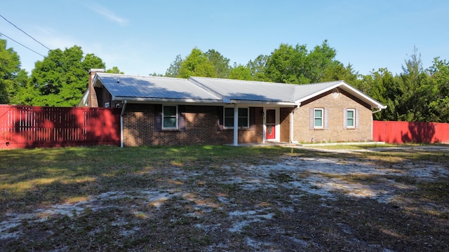 3961 Painter Branch Rd, Crestview, FL 32539 - ranch-style house with fence, brick siding, and metal roof
