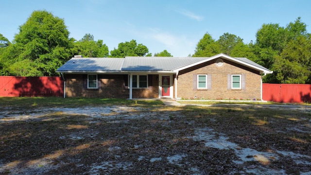 3961 Painter Branch Rd, Crestview, FL 32539 - ranch-style home featuring fence, metal roof, and brick siding