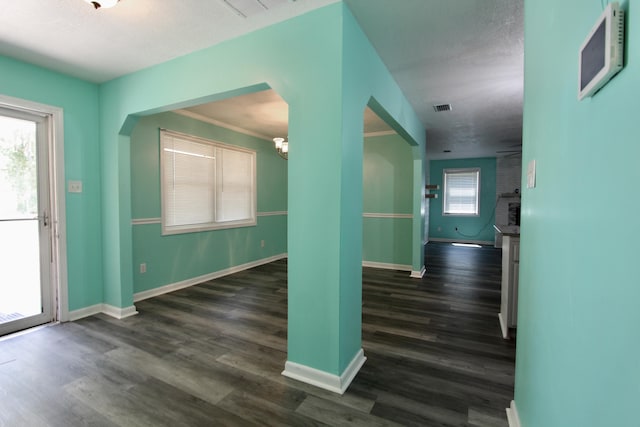 3961 Painter Branch Rd, Crestview, FL 32539 - foyer featuring baseboards, dark wood-style flooring, and a chandelier