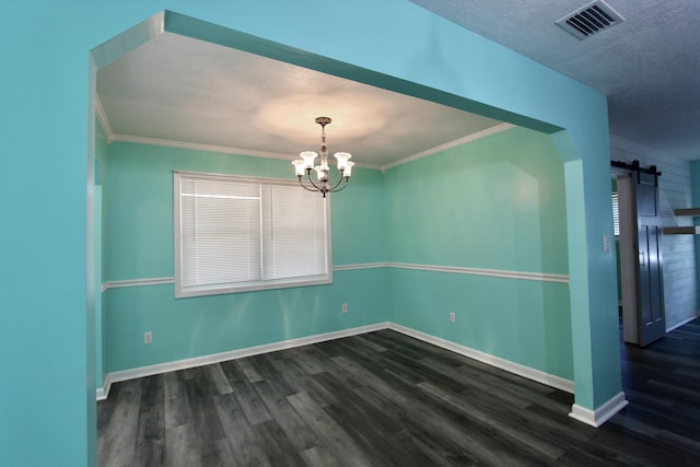3961 Painter Branch Rd, Crestview, FL 32539 - empty room featuring a barn door, wood finished floors, a chandelier, baseboards, and crown molding