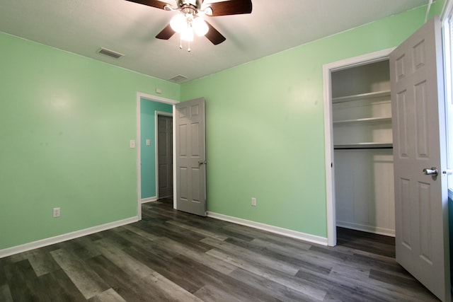 3961 Painter Branch Rd, Crestview, FL 32539 - unfurnished bedroom with dark wood finished floors, baseboards, a closet, and ceiling fan