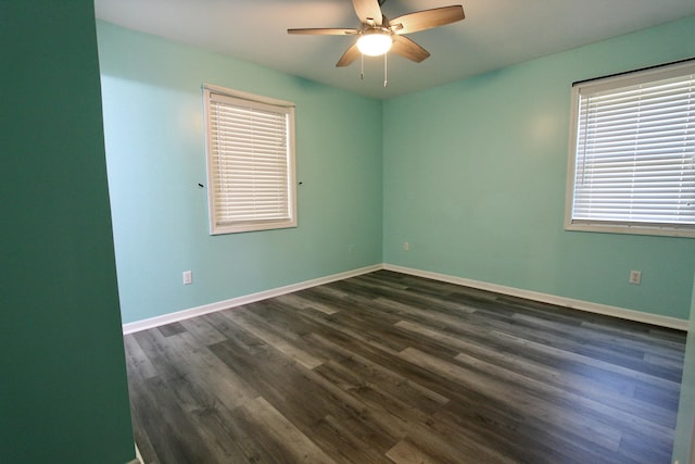 3961 Painter Branch Rd, Crestview, FL 32539 - unfurnished room featuring a ceiling fan, dark wood-style floors, and baseboards
