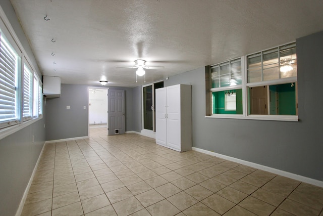 3961 Painter Branch Rd, Crestview, FL 32539 - unfurnished room featuring a ceiling fan, light tile patterned flooring, and baseboards