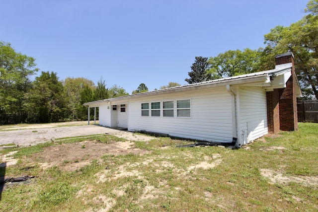 3961 Painter Branch Rd, Crestview, FL 32539 - rear view of house featuring a chimney and fence