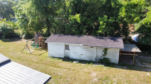 3961 Painter Branch Rd, Crestview, FL 32539 - back of house featuring a playground, a yard, an outdoor structure, and a deck