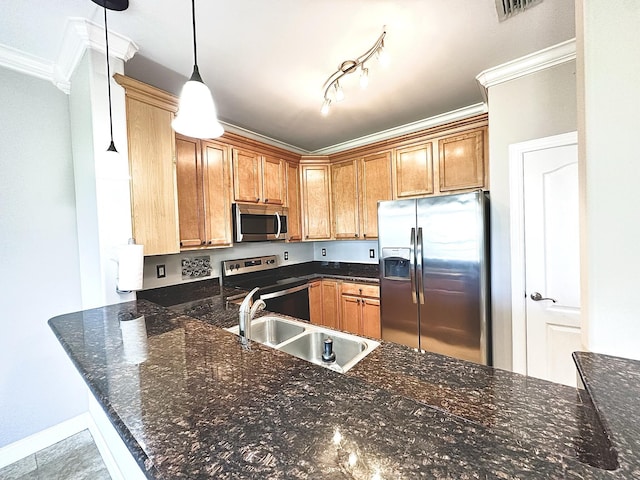 305 Mattie M Kelly Blvd, Destin, FL 32541 - kitchen featuring appliances with stainless steel finishes, crown molding, a sink, hanging light fixtures, and a peninsula