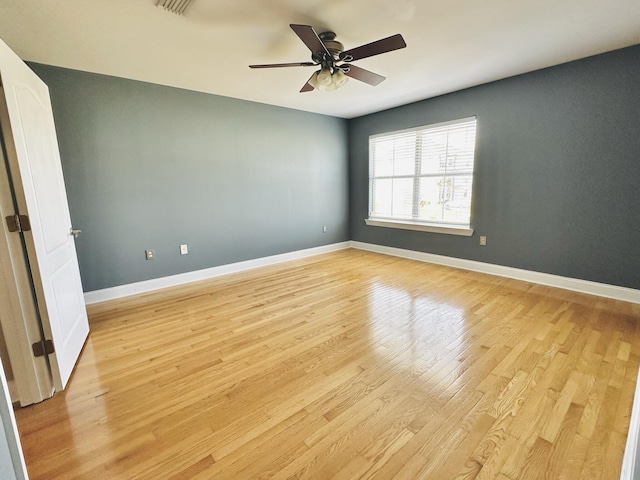 305 Mattie M Kelly Blvd, Destin, FL 32541 - spare room featuring light wood finished floors, a ceiling fan, and baseboards