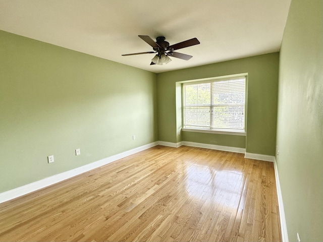 305 Mattie M Kelly Blvd, Destin, FL 32541 - unfurnished room with baseboards, a ceiling fan, and light wood-type flooring
