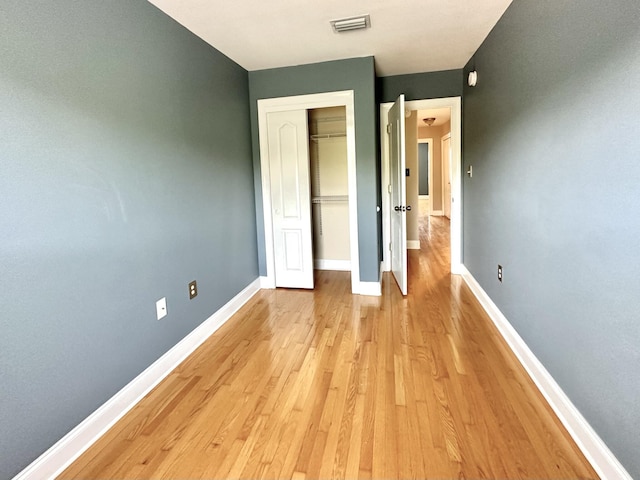 305 Mattie M Kelly Blvd, Destin, FL 32541 - unfurnished bedroom featuring light wood finished floors, baseboards, and a closet