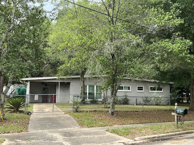 123 Panama Dr, Crestview, FL 32536 - view of front of property with driveway, a fenced front yard, an attached carport, and a gate