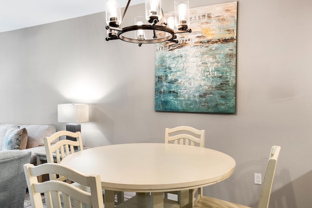 dining space with a chandelier