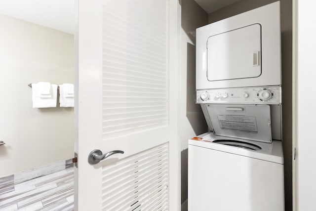 laundry area with estacked washer and dryer