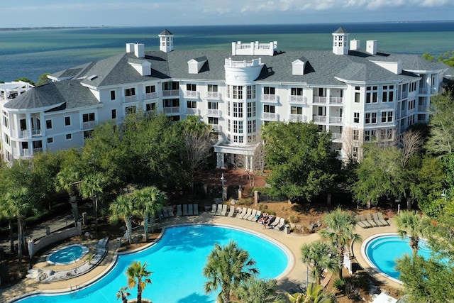 bird's eye view of a pool and a large body of water