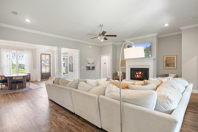 410 Coastal Breeze Dr, Freeport, FL 32439 - living room featuring dark wood finished floors, crown molding, a glass covered fireplace, ceiling fan, and baseboards