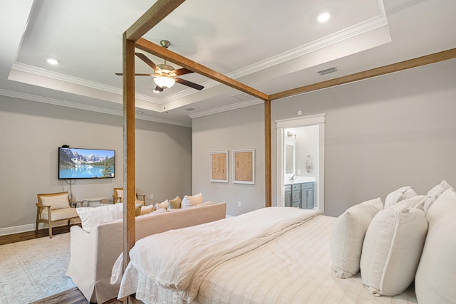 410 Coastal Breeze Dr, Freeport, FL 32439 - bedroom with a tray ceiling, wood finished floors, ornamental molding, baseboards, and recessed lighting