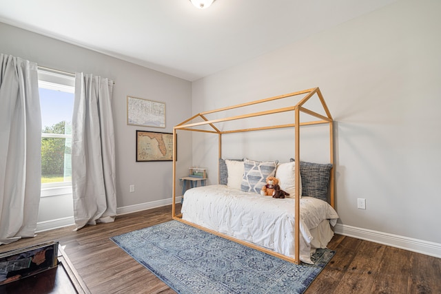 410 Coastal Breeze Dr, Freeport, FL 32439 - bedroom with baseboards and wood finished floors