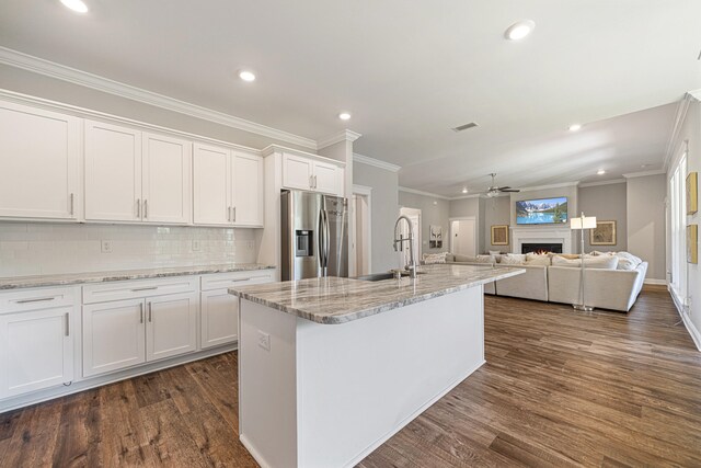 410 Coastal Breeze Dr, Freeport, FL 32439 - kitchen with stainless steel refrigerator with ice dispenser, a sink, dark wood-type flooring, ornamental molding, and white cabinetry