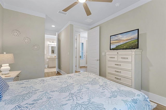 bedroom featuring light wood-type flooring, recessed lighting, ensuite bath, baseboards, and a ceiling fan