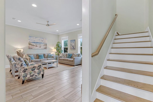 living room featuring ceiling fan, stairway, crown molding, wood finished floors, and recessed lighting