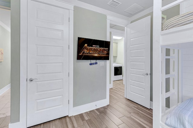 unfurnished bedroom with wood finished floors and baseboards