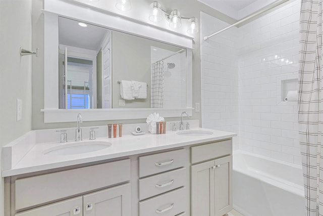 bathroom with shower / bath combo and double vanity
