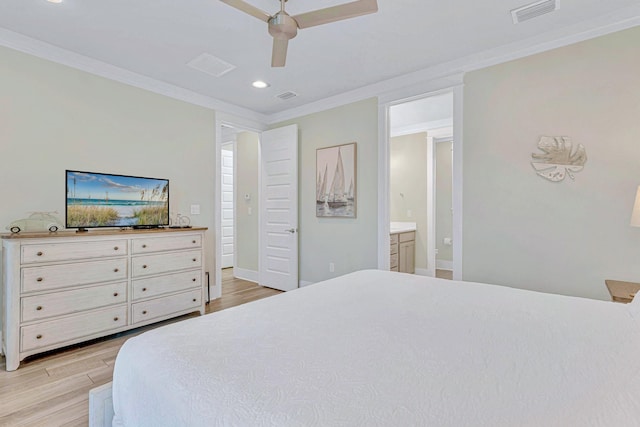bedroom with crown molding, light wood-style floors, recessed lighting, ensuite bath, and baseboards