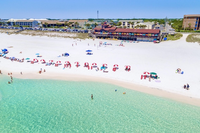 aerial view of waterfront with a beach