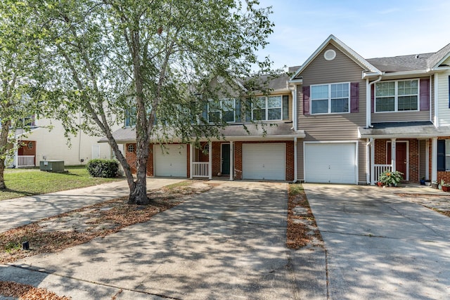 282 Swaying Pine Ct, Crestview, FL 32539 - multi unit property featuring driveway, brick siding, a garage, and central AC