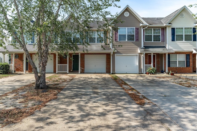 282 Swaying Pine Ct, Crestview, FL 32539 - townhome / multi-family property featuring driveway, an attached garage, and brick siding