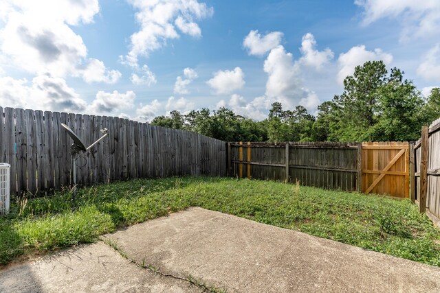 282 Swaying Pine Ct, Crestview, FL 32539 - fenced backyard featuring a patio