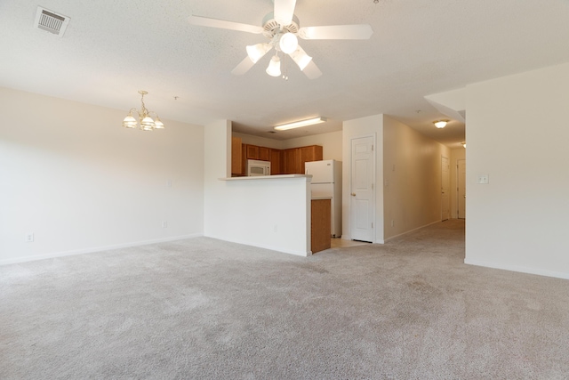 282 Swaying Pine Ct, Crestview, FL 32539 - unfurnished living room with light carpet, a ceiling fan, a chandelier, and baseboards