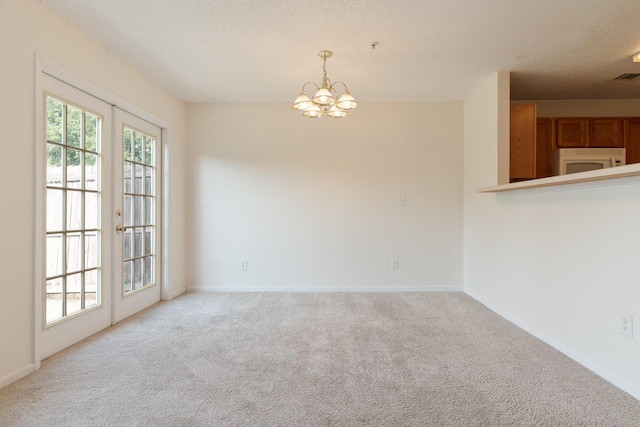 282 Swaying Pine Ct, Crestview, FL 32539 - unfurnished dining area with light carpet, a chandelier, and baseboards