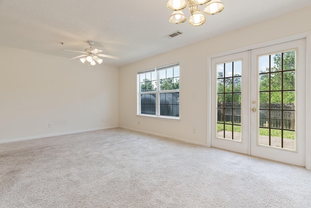 282 Swaying Pine Ct, Crestview, FL 32539 - carpeted empty room with a chandelier, baseboards, ceiling fan, and a textured ceiling