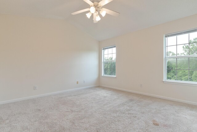 282 Swaying Pine Ct, Crestview, FL 32539 - empty room with vaulted ceiling, light carpet, ceiling fan, and baseboards