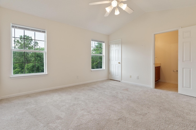 282 Swaying Pine Ct, Crestview, FL 32539 - unfurnished bedroom featuring multiple windows, carpet flooring, vaulted ceiling, and baseboards