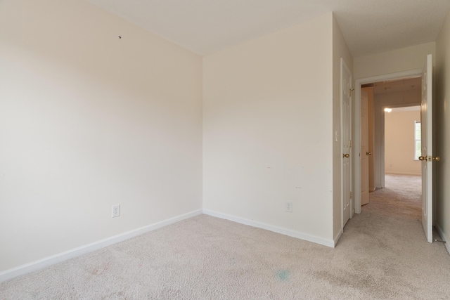 282 Swaying Pine Ct, Crestview, FL 32539 - spare room featuring light colored carpet and baseboards