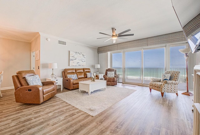 8601 Surf Dr Unit 2W, Panama City Beach, FL 32408 - living area featuring a ceiling fan, light wood-style flooring, crown molding, and baseboards