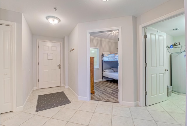 8601 Surf Dr Unit 2W, Panama City Beach, FL 32408 - foyer featuring light tile patterned floors and baseboards