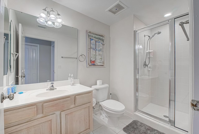 8601 Surf Dr Unit 2W, Panama City Beach, FL 32408 - full bathroom featuring a shower stall, tile patterned floors, toilet, and vanity