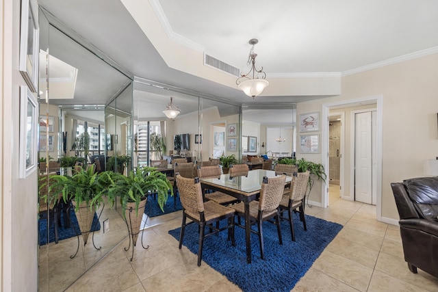 1096 Scenic Gulf Dr Unit 606, Miramar Beach, FL 32550 - dining space featuring crown molding, light tile patterned floors, and baseboards