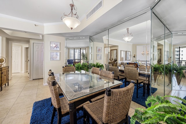 1096 Scenic Gulf Dr Unit 606, Miramar Beach, FL 32550 - dining room with light tile patterned floors, plenty of natural light, and crown molding