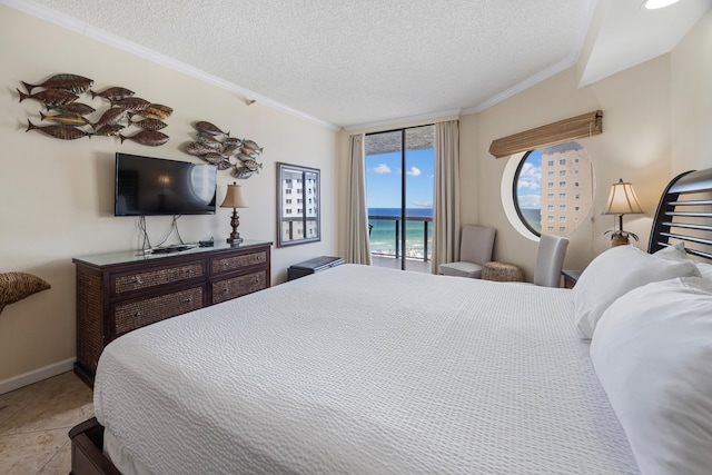 1096 Scenic Gulf Dr Unit 606, Miramar Beach, FL 32550 - tiled bedroom featuring crown molding, a textured ceiling, and baseboards