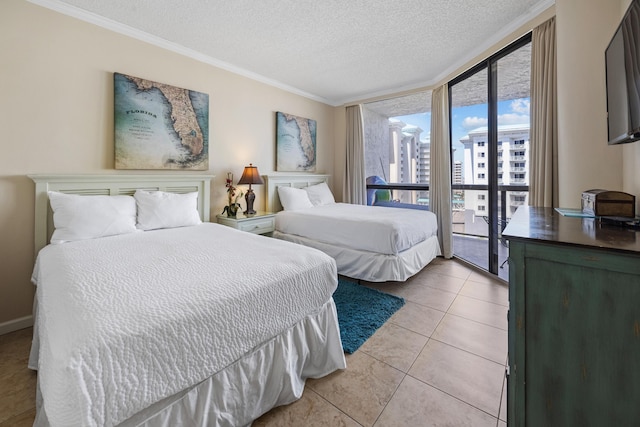 1096 Scenic Gulf Dr Unit 606, Miramar Beach, FL 32550 - bedroom featuring a textured ceiling, ornamental molding, and light tile patterned floors