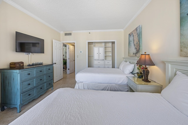 1096 Scenic Gulf Dr Unit 606, Miramar Beach, FL 32550 - bedroom with ornamental molding, a textured ceiling, and a closet