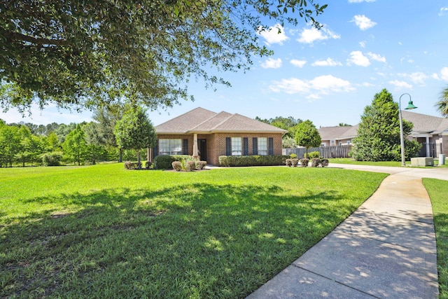 ranch-style home featuring brick siding