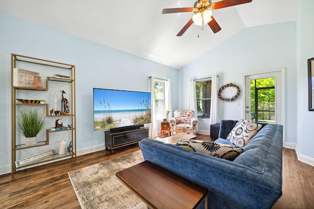 living room with ceiling fan, wood finished floors, baseboards, and high vaulted ceiling