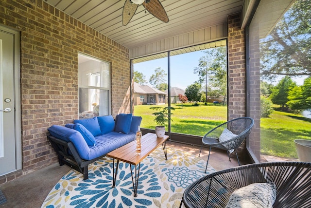 sunroom with ceiling fan and an outdoor hangout area
