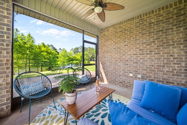 sunroom featuring ceiling fan and outdoor lounge area