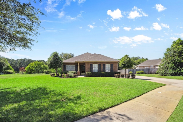 view of front facade featuring driveway and brick siding